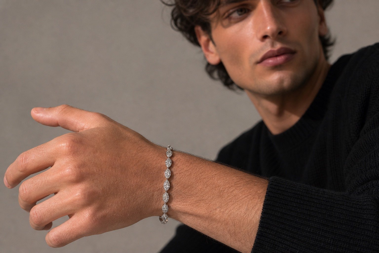 Adult man wearing the platinum Marquise Bracelet with a relaxed fit